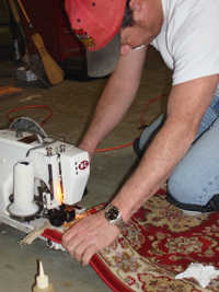 technician performing rug repair in Raleigh NC
