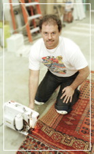 Jim Reynolds performing a rug repair